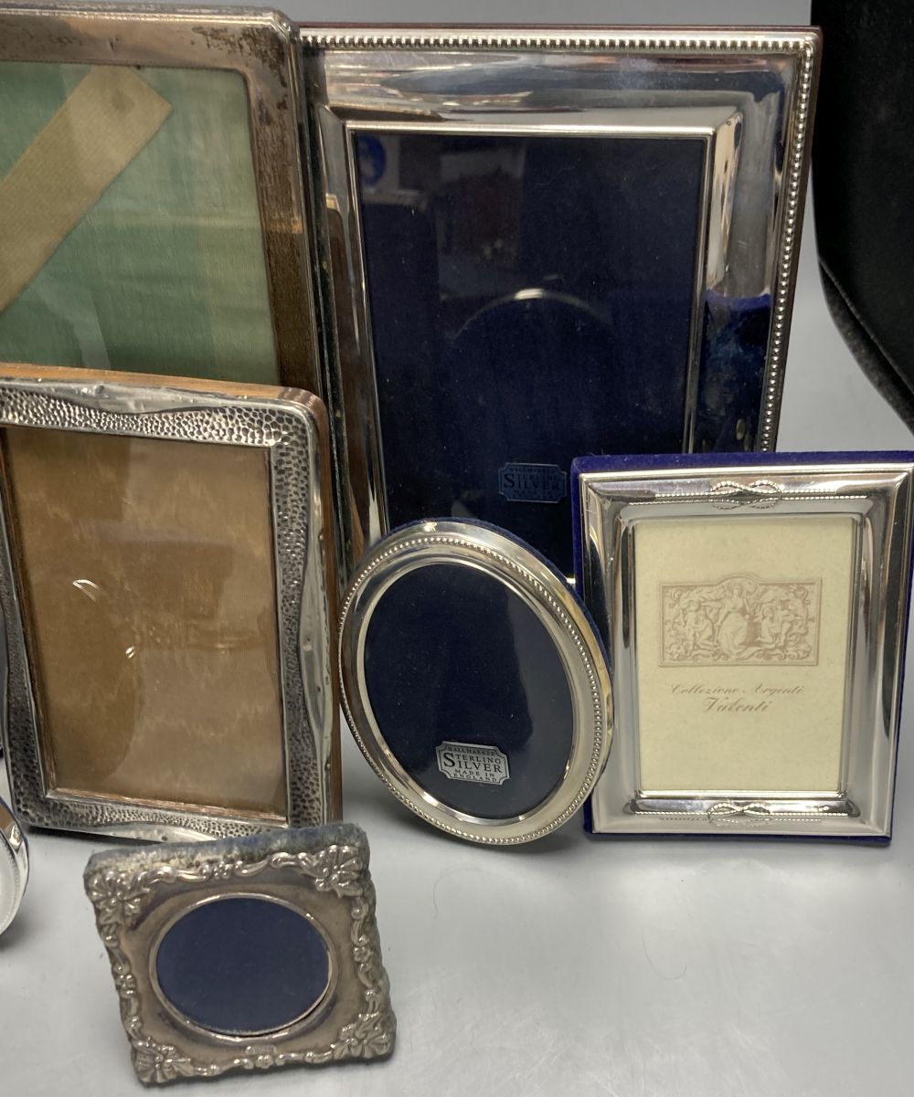 Two George V silver mounted photograph frames, largest 21cm, nine other modern silver frames and two cased silver crowns etc.